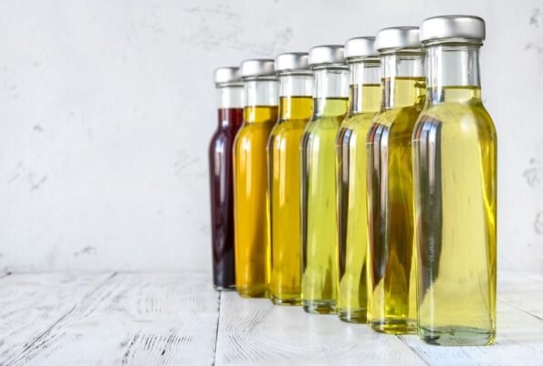 Row of cooking oil bottles.